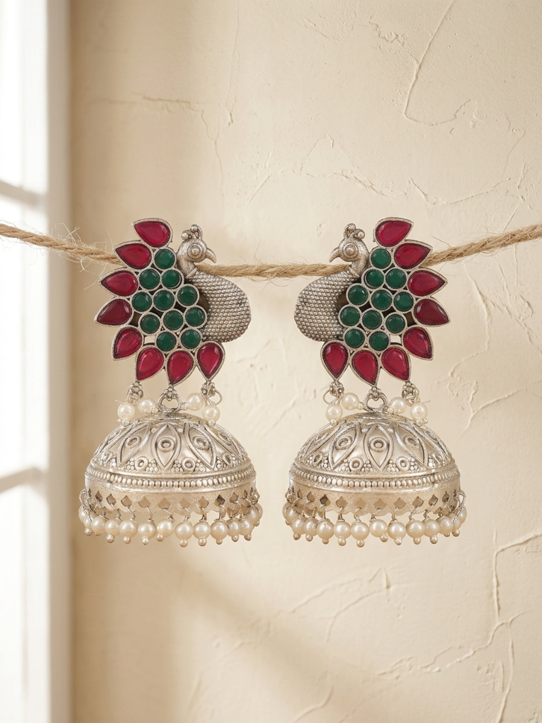 Peacock Jhumka Earrings — Red & Green Stone, Silver Finish