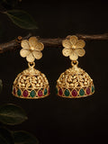 Gold floral earrings with red and green gemstones on a dark background