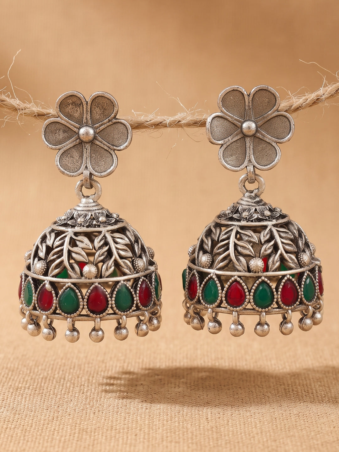 Floral Red & Green Stone Jhumka Earrings — Silver Tone