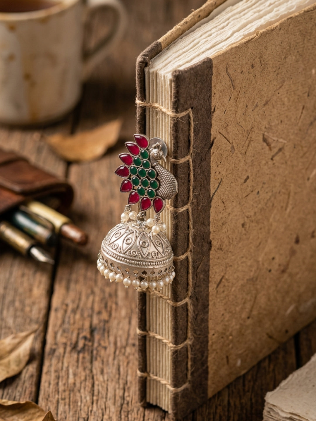Peacock Jhumka Earrings — Red & Green Stone, Silver Finish