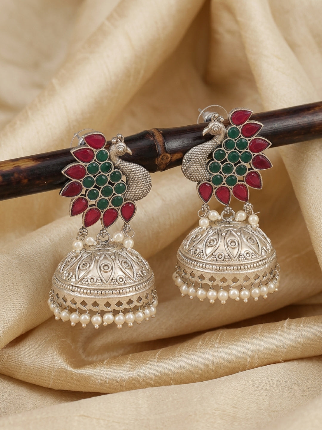 Peacock Jhumka Earrings — Red & Green Stone, Silver Finish
