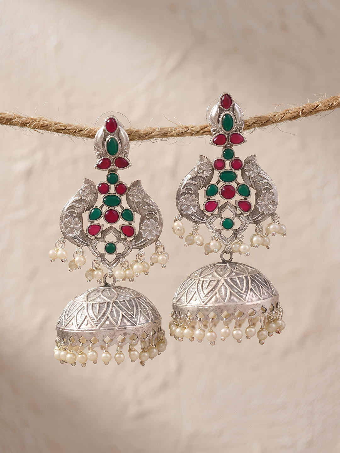 Peacock Jhumki Earrings — Red & Green Stones, Silver Finish