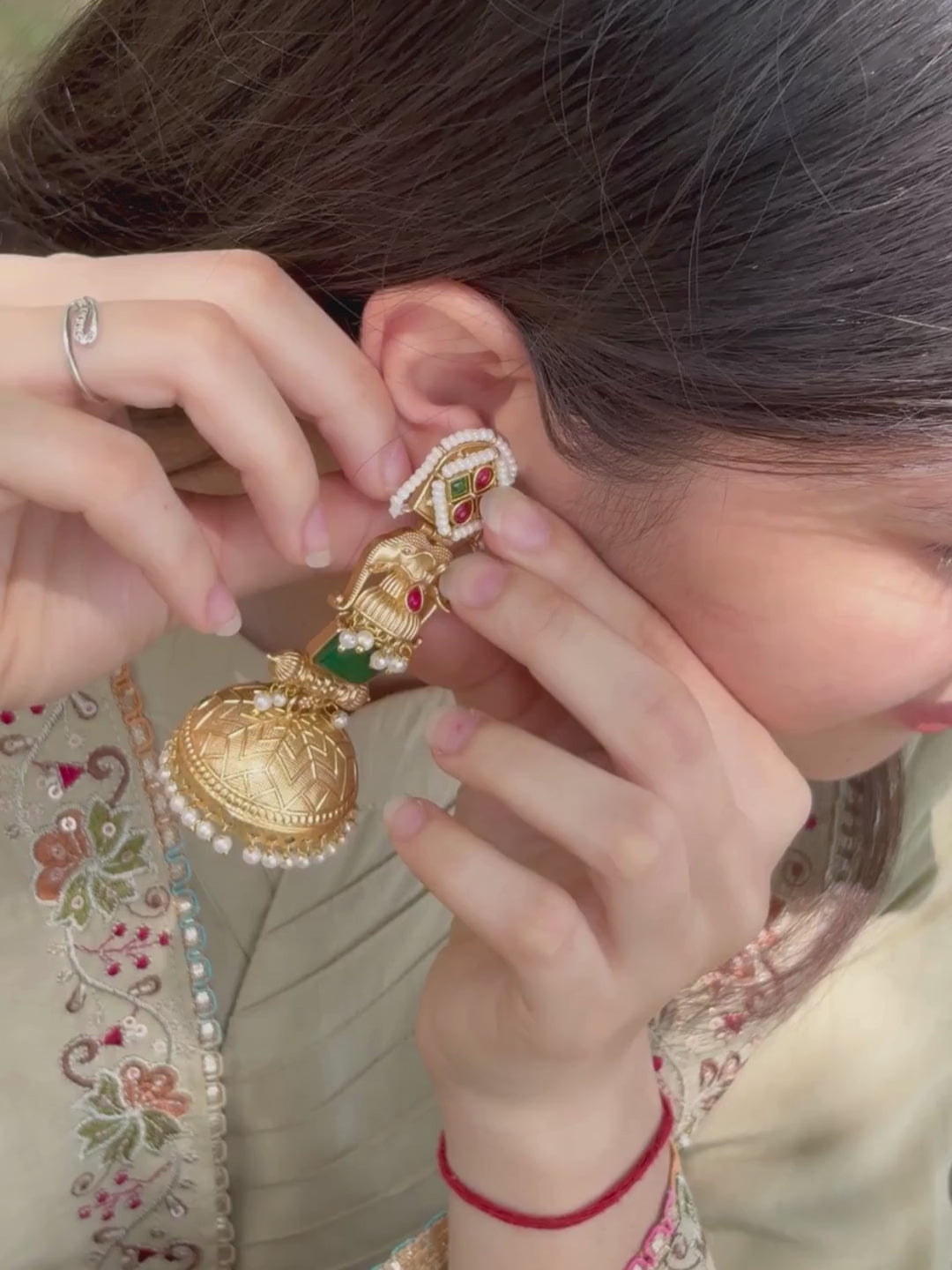 Green Stone Elephant Motif Gold Jhumka Earrings